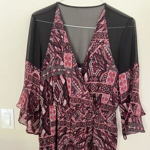 BCBGeneration Romper with shear accents.